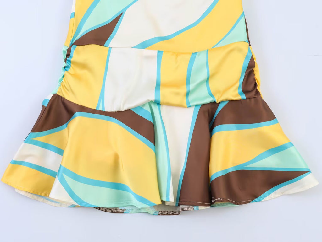 Pleated skirt portion with elastic waist and multi-color geometric print, brown side