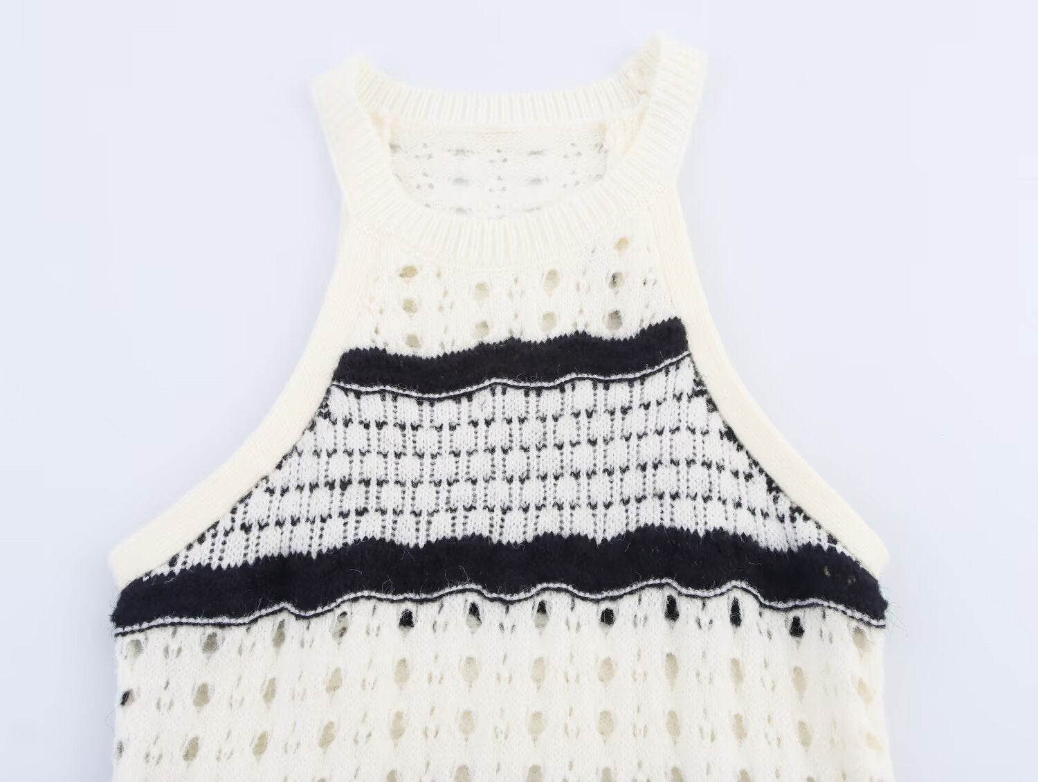 Sleeveless knit mini dress with ribbed crew neck and black stripe band at the bust