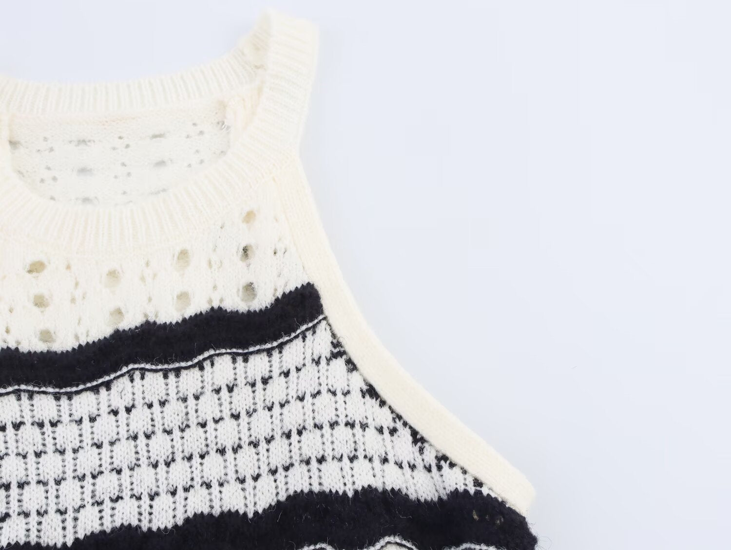 Sleeveless knit mini dress with ribbed crew neck and striped yoke detail