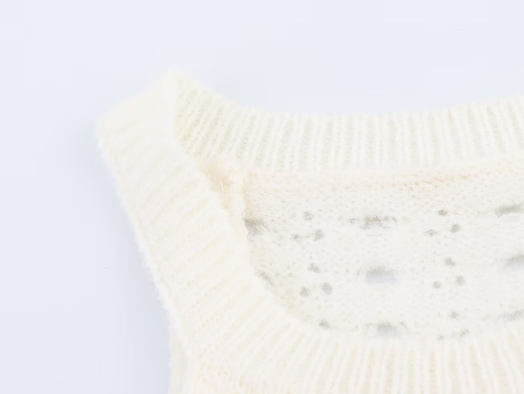 Cream knit mini dress with sleeveless arms and ribbed crew neck