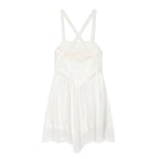 White mini summer dress with crossed spaghetti straps and tiered skirt with lace hem
