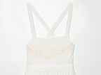 White mini summer dress bodice with cross-back spaghetti straps and embroidered bust detail