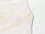 White mini summer dress with embroidered bodice and delicate shoulder straps