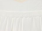 White mini summer dress tiered skirt with embroidered trim and ruffled waistline