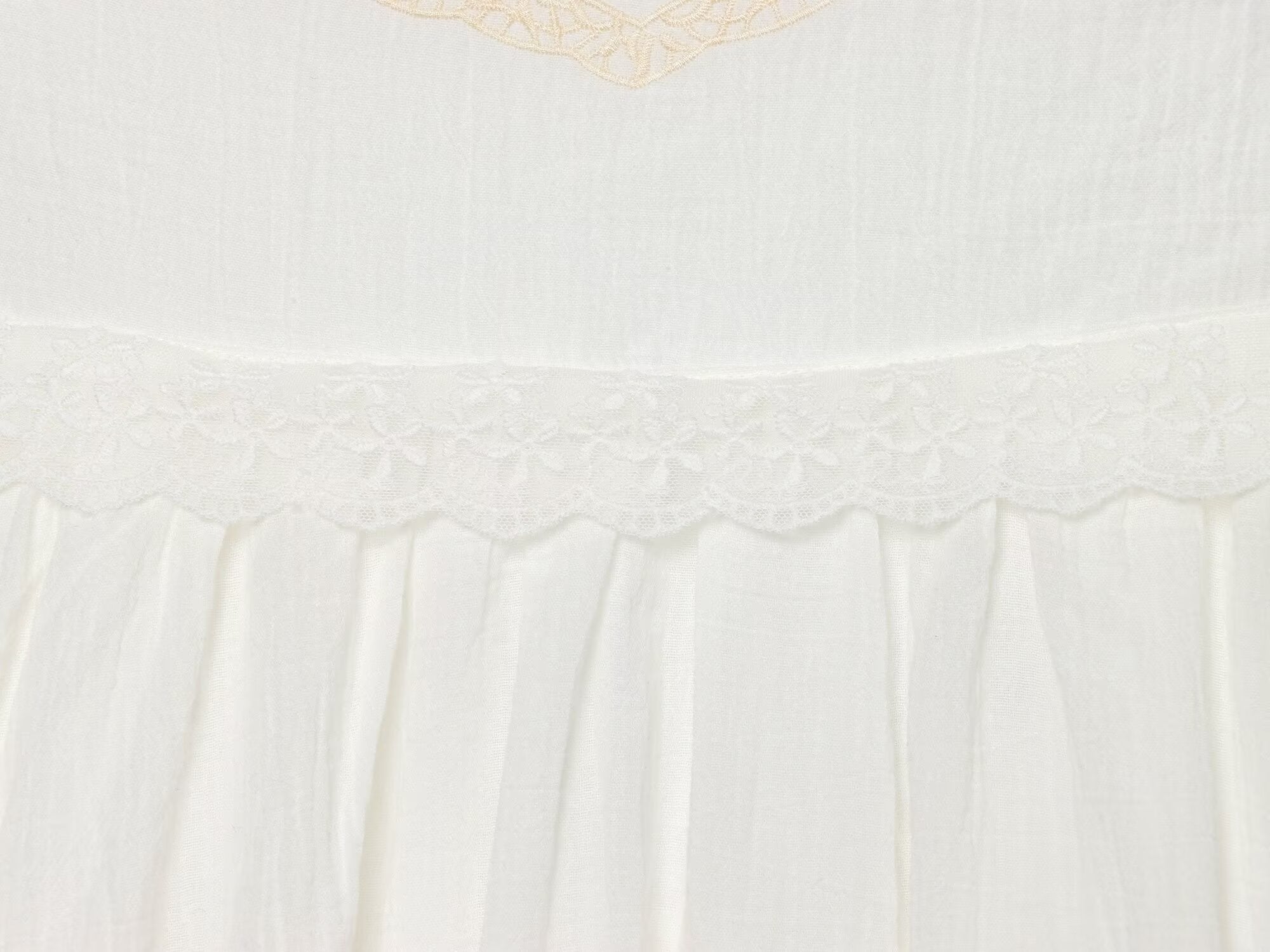 White mini summer dress tiered skirt with embroidered trim and ruffled waistline