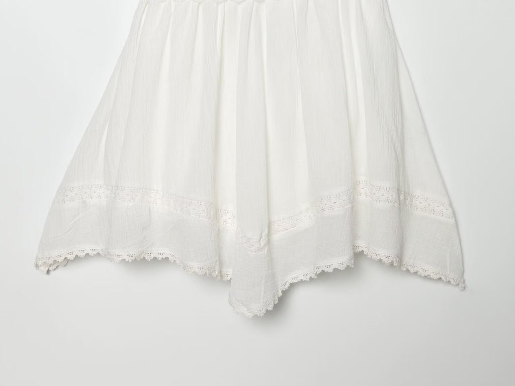 White mini summer dress with pleated skirt and scalloped lace hem