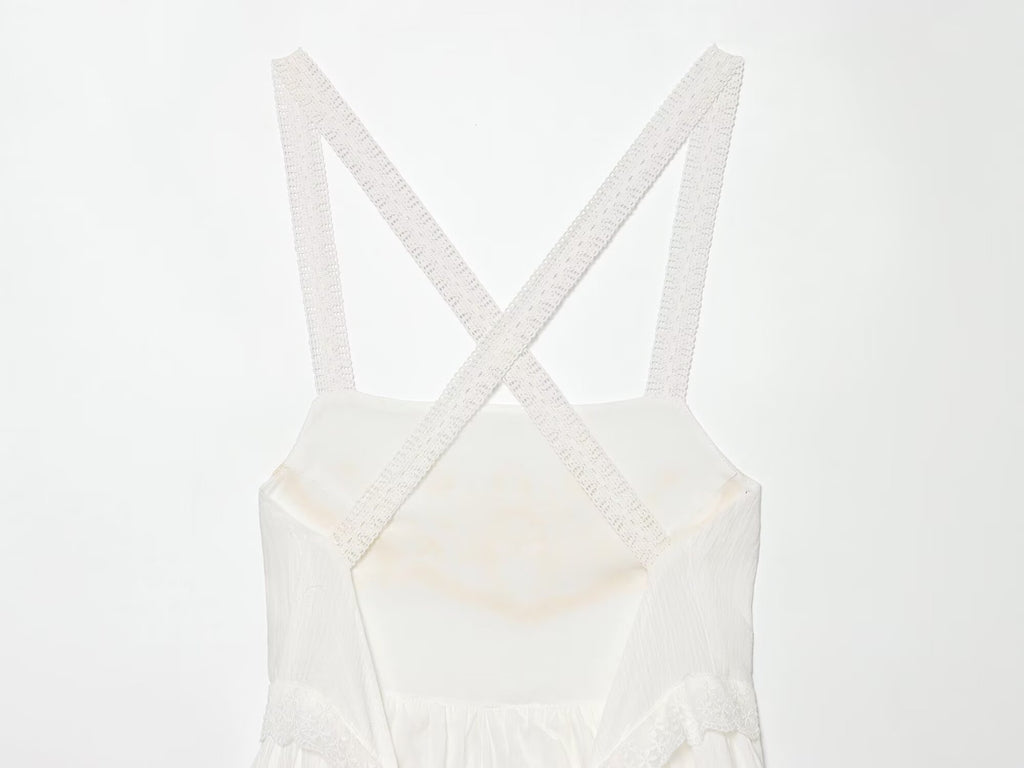 White mini summer dress with crisscross straps and square neckline