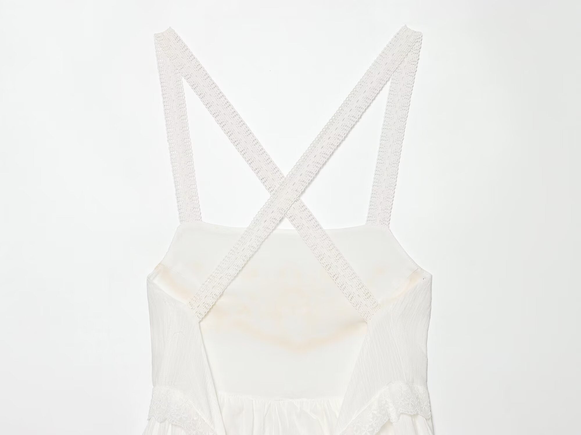 White mini summer dress with crisscross straps and square neckline