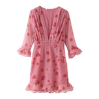 Pink ruffled summer dress with red floral print, tiered hem and 3/4 ruffle sleeves