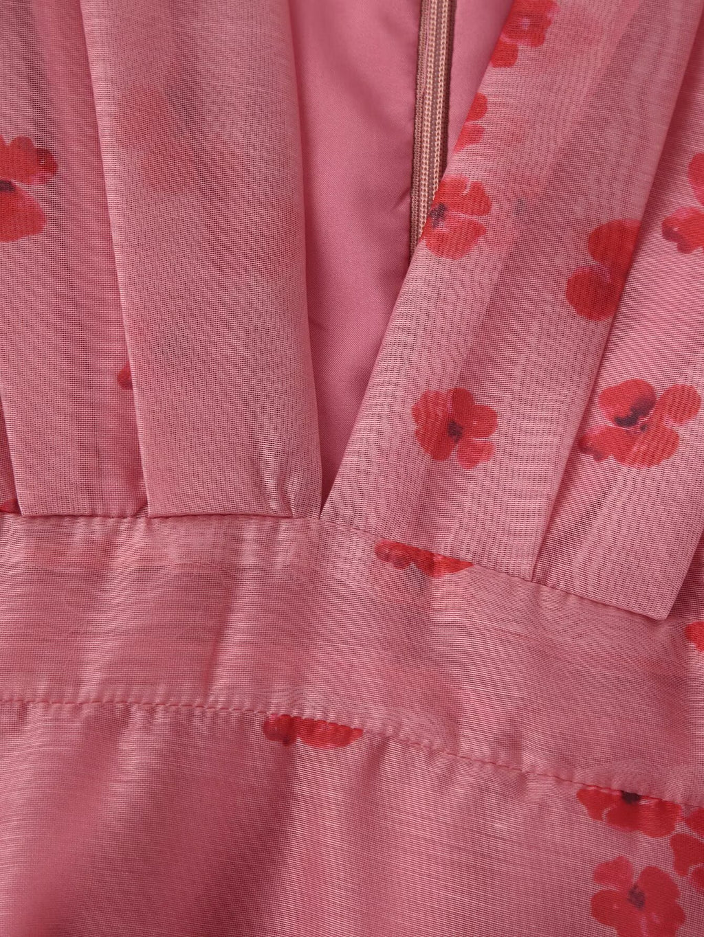 Pink floral dress close-up of skirt tiers and waistband seam