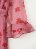 Pink floral dress cuff with layered ruffle at sleeve and hem
