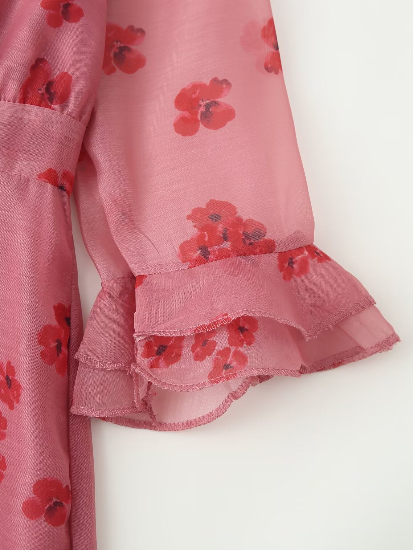 Pink floral dress cuff with layered ruffle at sleeve and hem