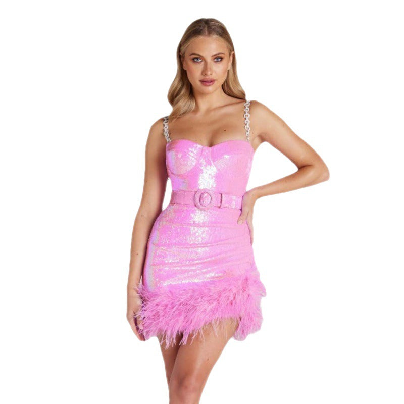 Pink sequin slip dress with chain straps and feathered mini hem, sweetheart bustier