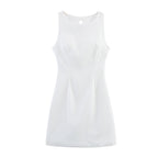White sleeveless dress with round neckline and buttoned back keyhole
