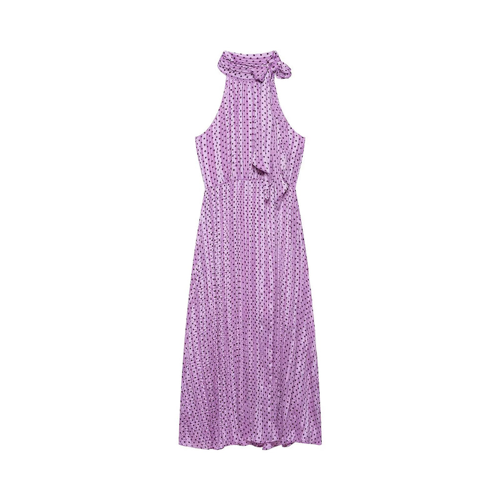Violet polka-dot sleeveless dress with ruffled halter neckline and tied shoulder bow