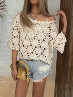 Women’s white openwork knit sweater, round neckline, loose 3/4 sleeves