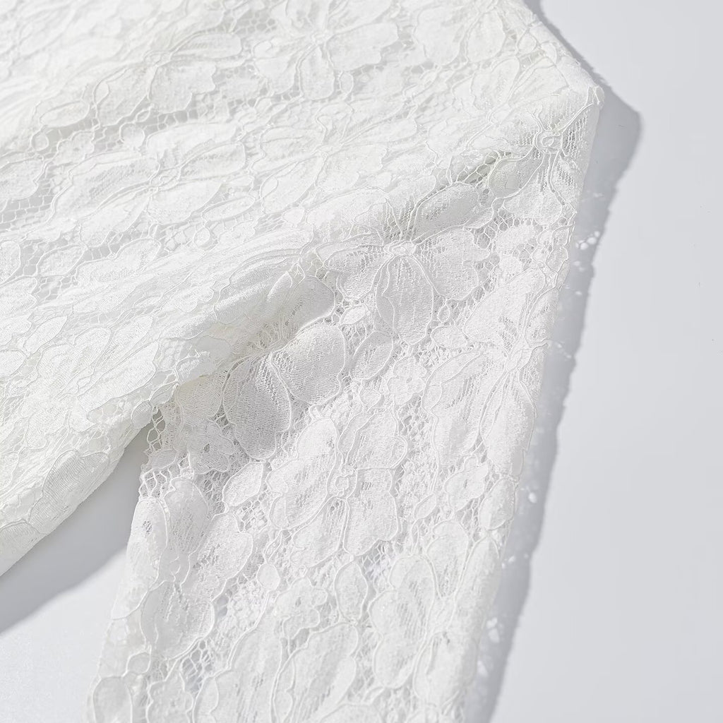 White lace side panel close-up with textured floral pattern