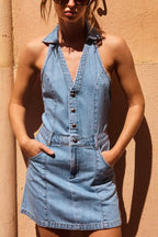 Blue denim halter mini dress with button front and seam detailing