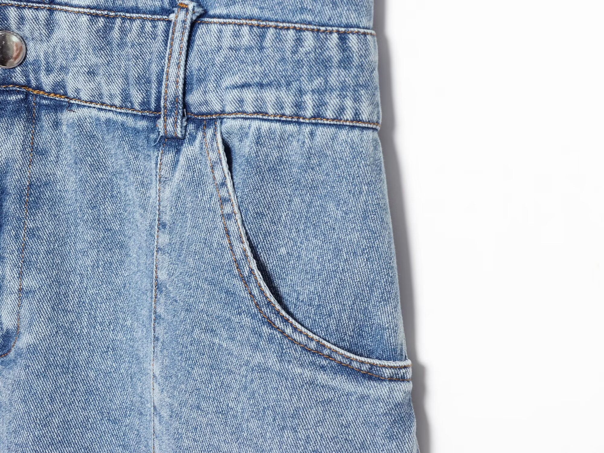 Blue denim mini dress waist with belt loops and stitched pocket detail