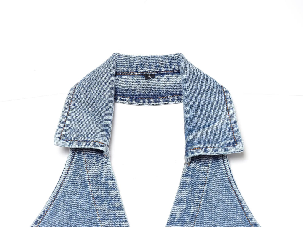 Back neckline of blue denim halter mini dress with adjustable strap