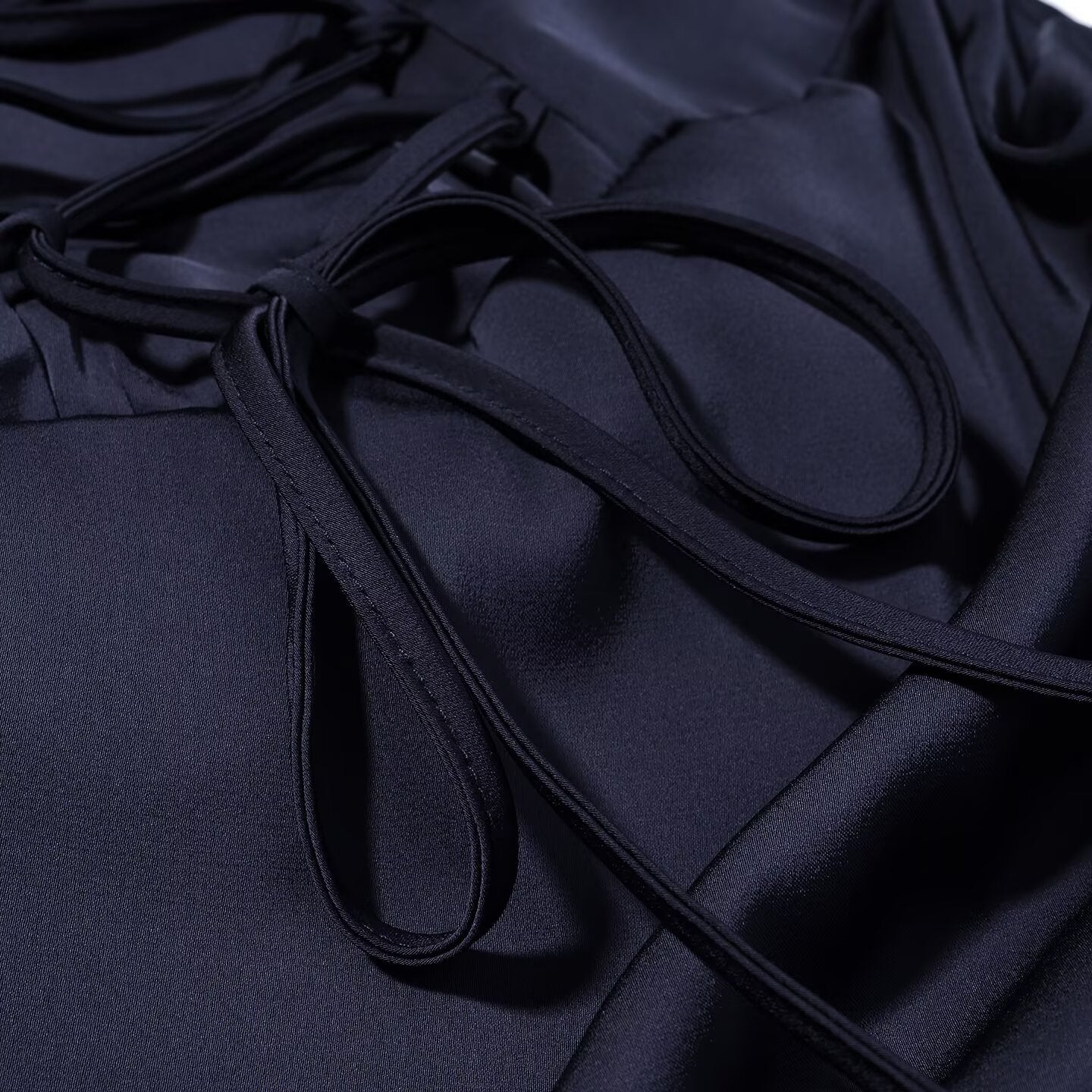 Navy blue dress with thin tie strings and ruched bodice edge detail