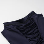 Navy blue dress neckline with gathered straps and ruched panel detail