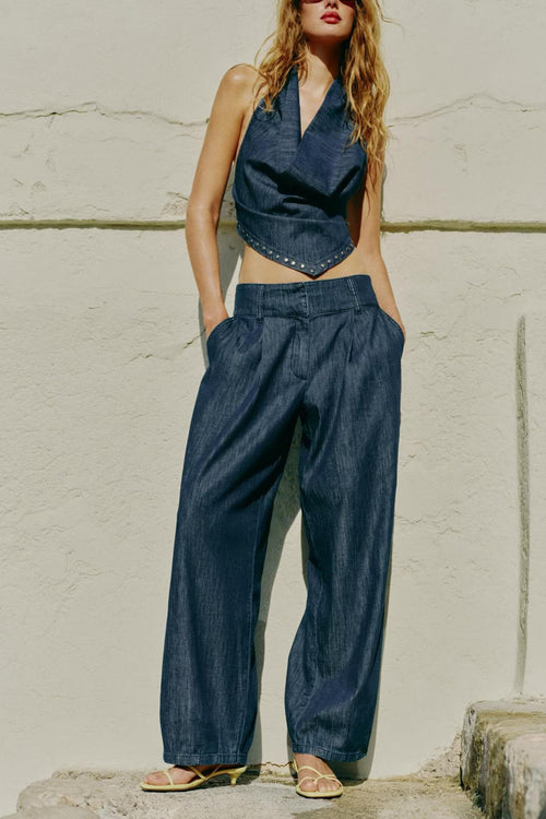 Two-piece women’s denim-look backless top and wide-leg pants set with rivet trim
