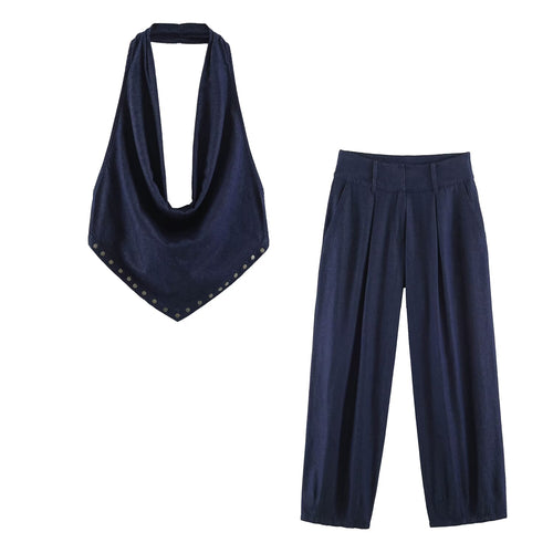 Denim-look backless halter top with hanging bib collar and navy wide-leg pants