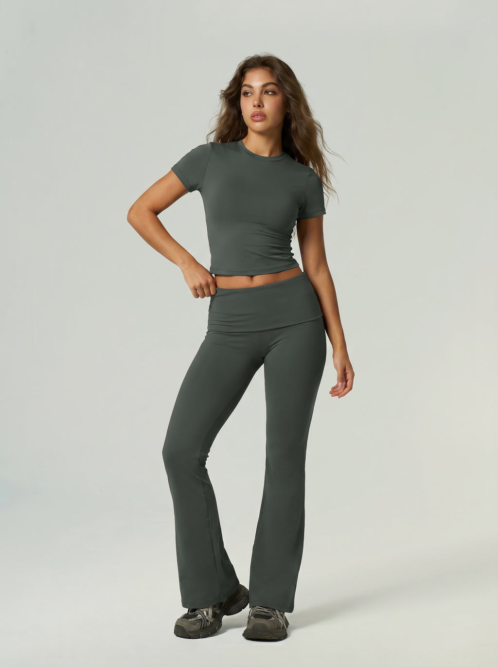 Dark green short-sleeve sports top and high-waist flared leggings set