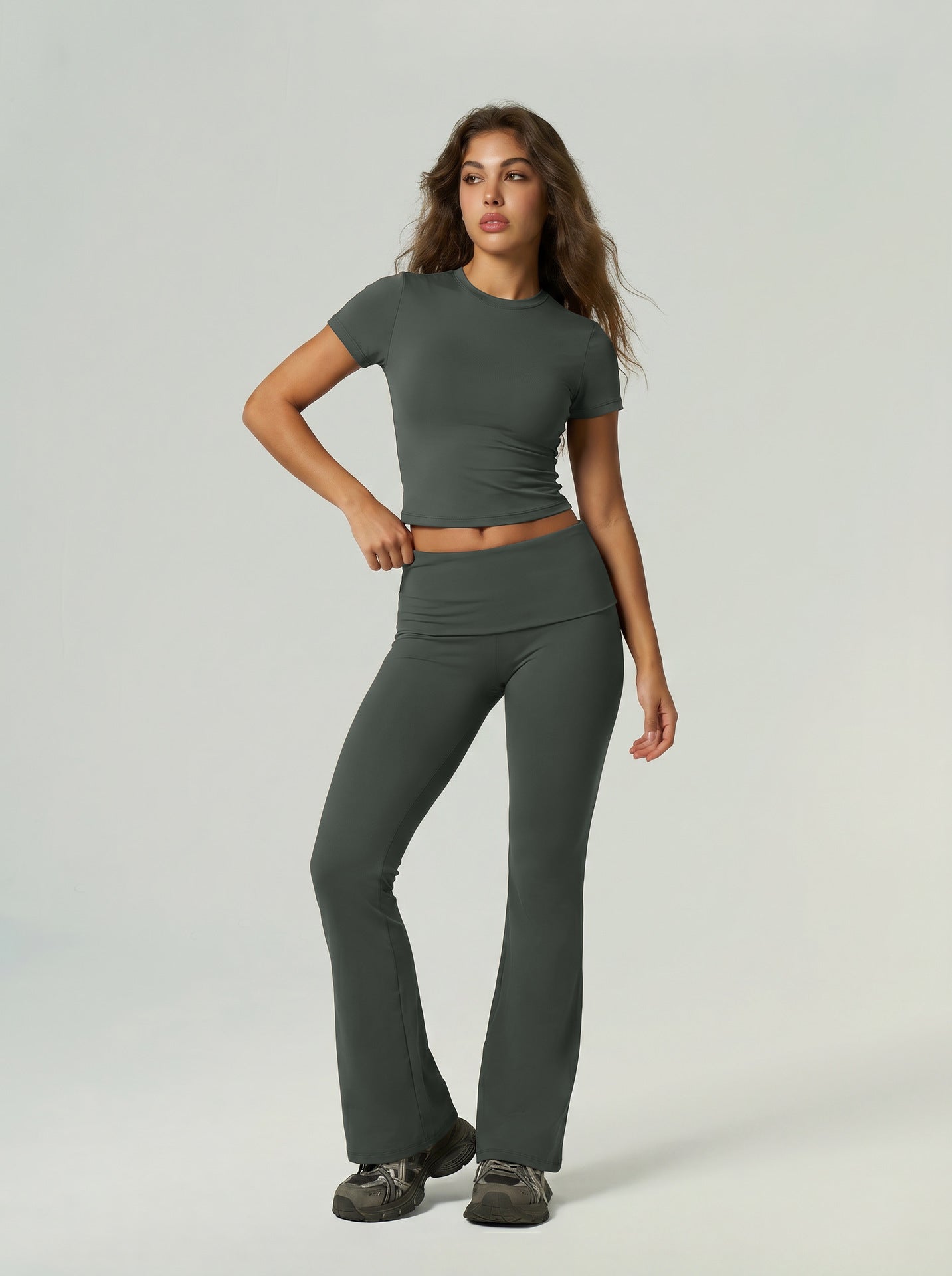 Dark green short-sleeve sports top and high-waist flared leggings set