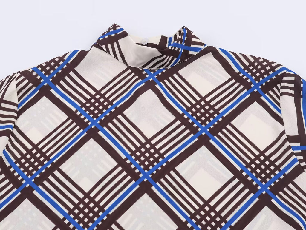 Close-up of multi plaid turtleneck collar with high neckline
