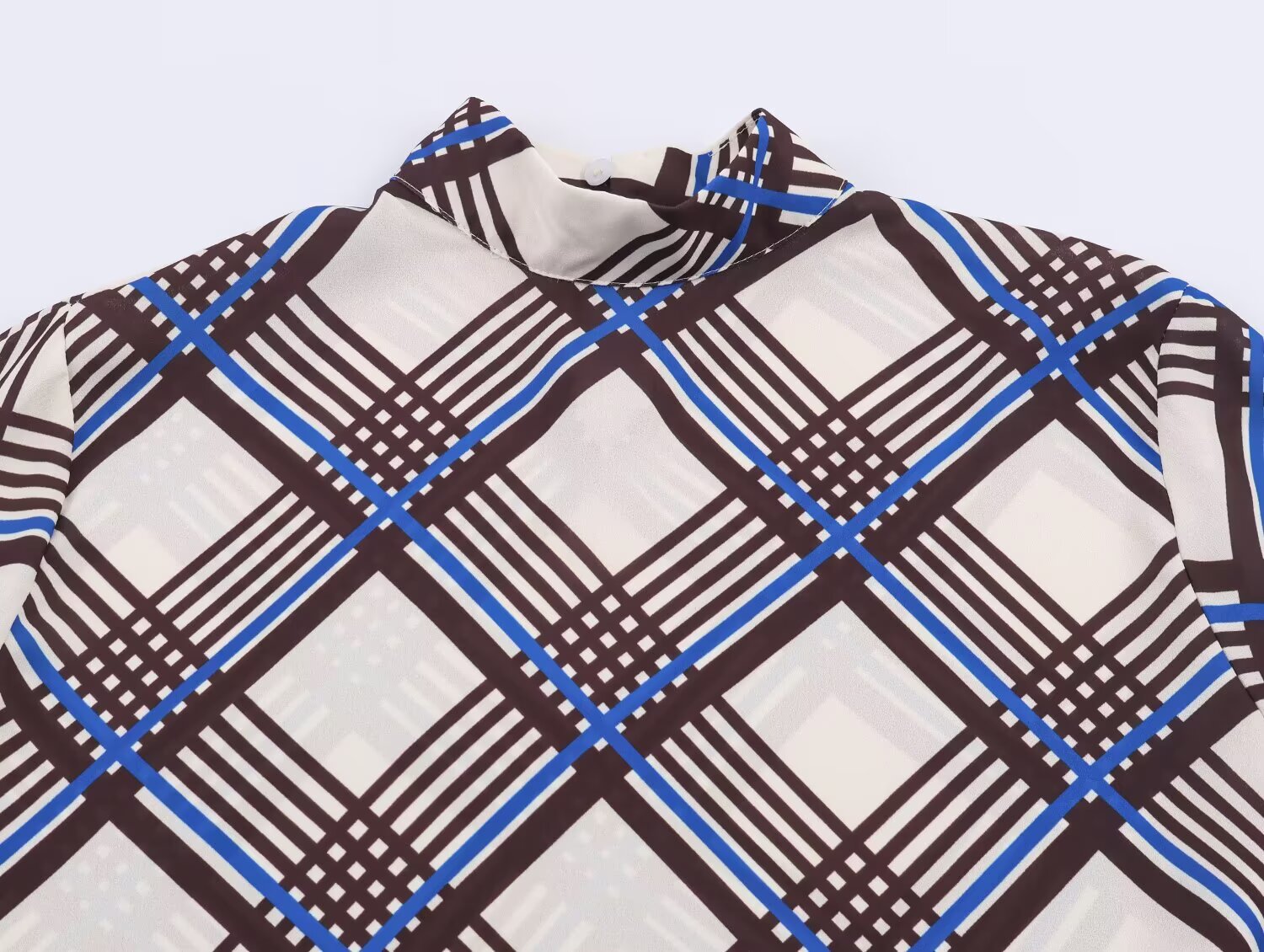 Close-up of multi plaid turtleneck collar with high neckline