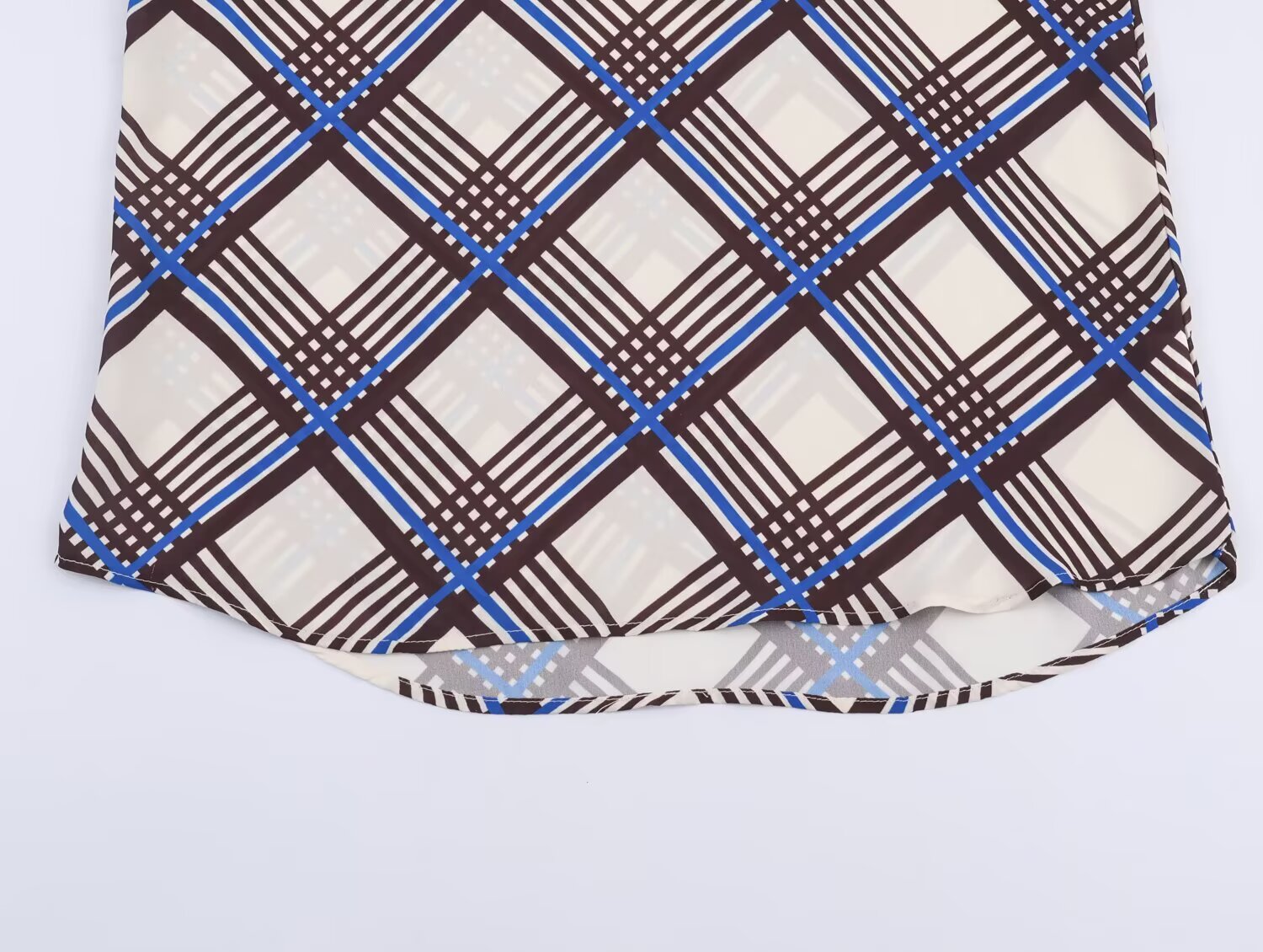Plaid turtleneck shirt hem with multi-color check pattern