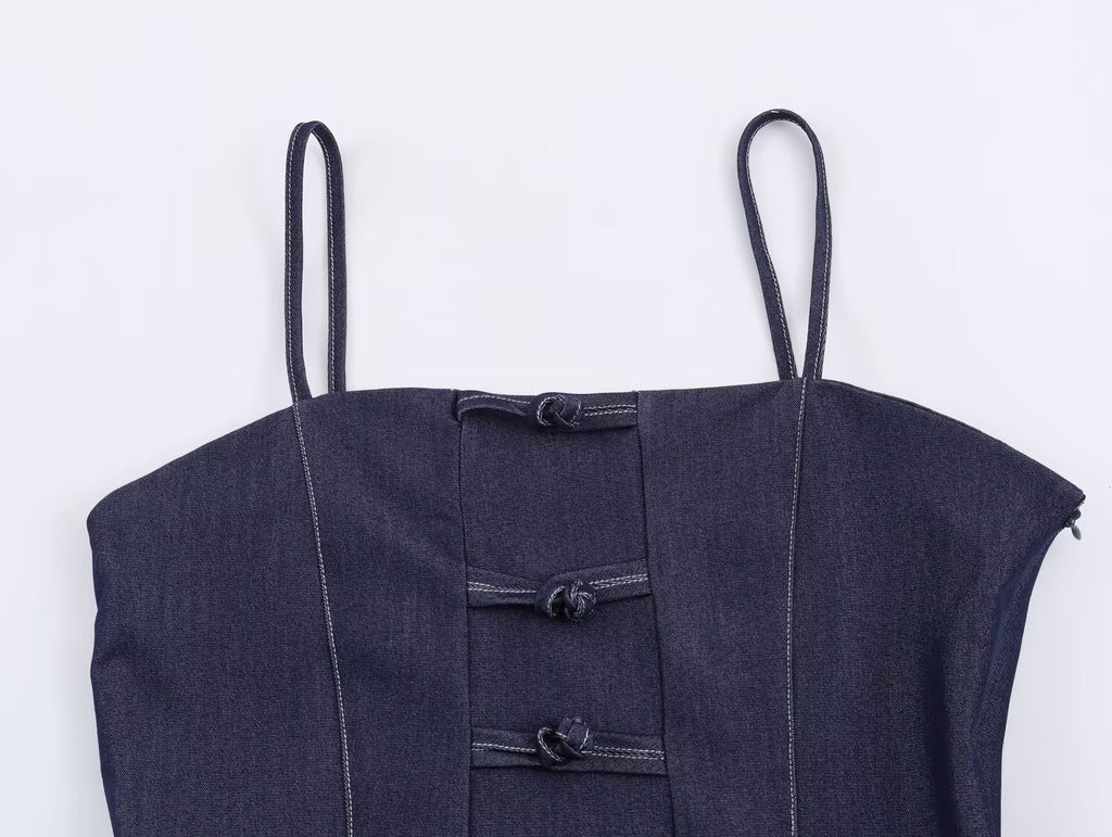 Deep blue denim sling top with button placket and stitched bib panel