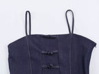 Deep blue denim sling top with button placket and stitched bib panel
