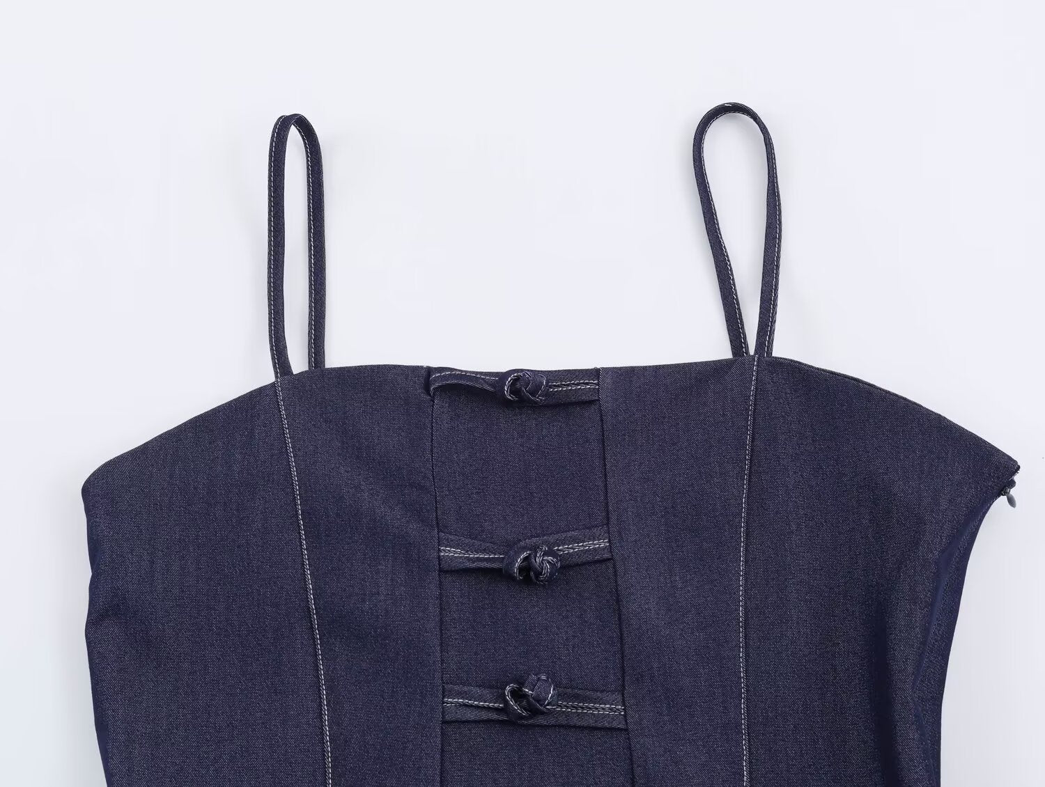 Deep blue denim sling top with button placket and stitched bib panel