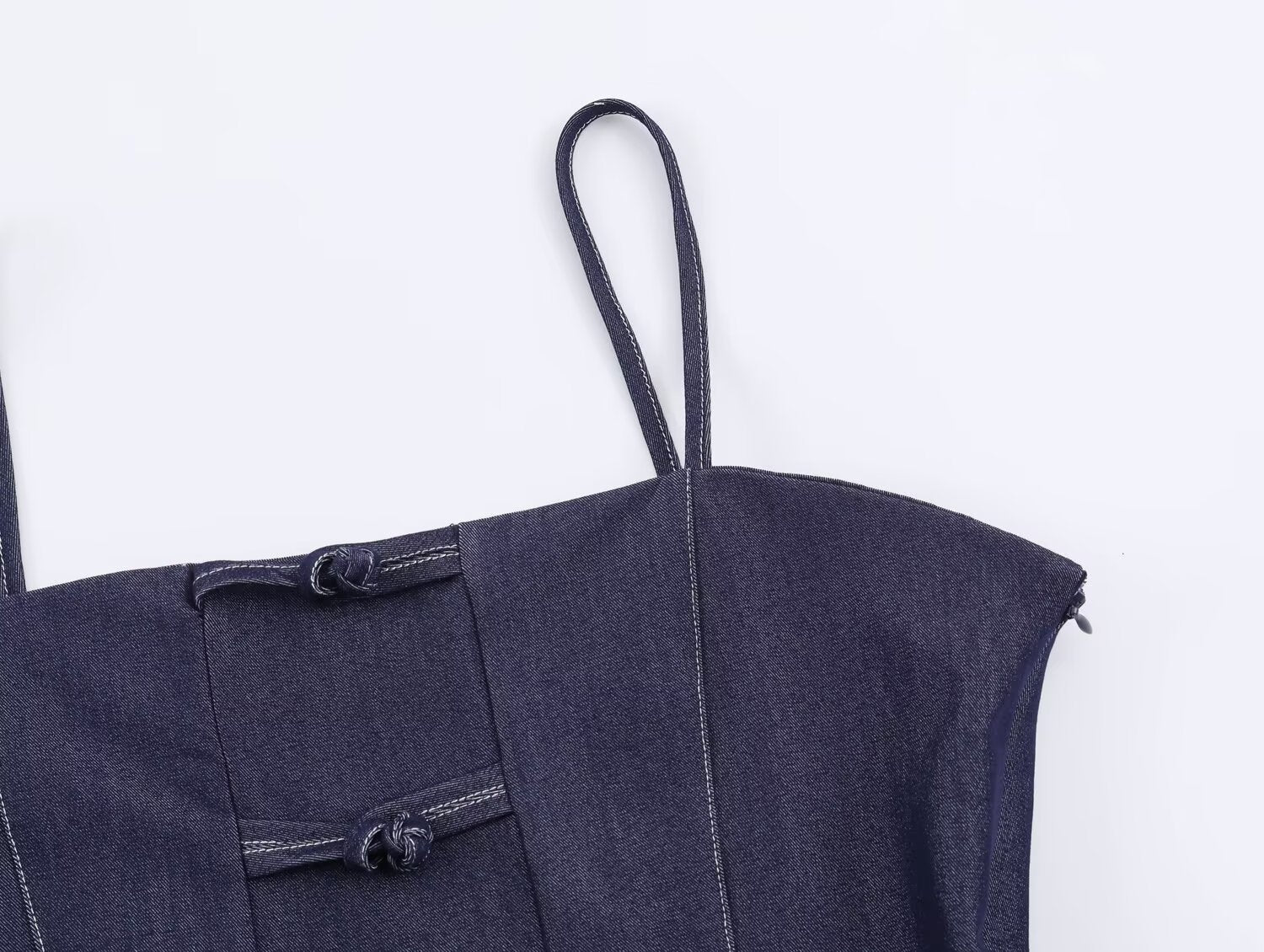 Deep blue denim women’s sling top with adjustable straps and button detail