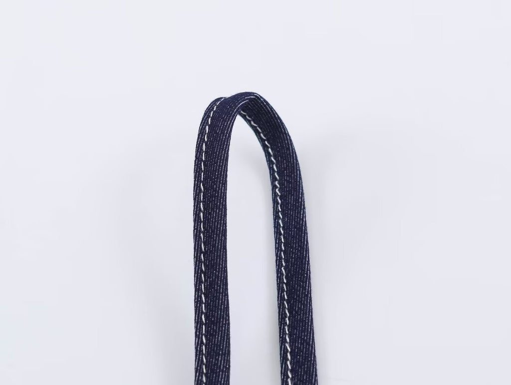 Deep blue adjustable spaghetti strap with stitched loop detail