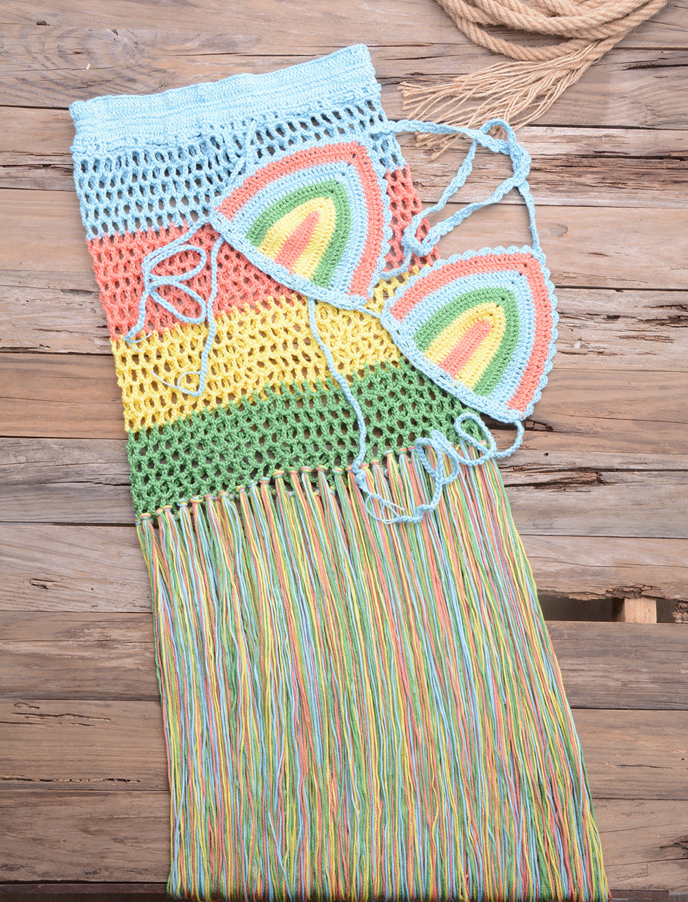 Sky-blue crochet bikini top and fringe skirt piece with rainbow block triangle panels