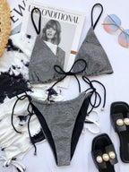 Silver-gray glitter triangle bikini set with black string ties and cheeky bottoms