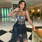 Black halter sequin dress with structured corset neckline and short tulle hem
