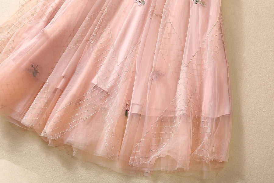 Pink tulle skirt with gathered ruffles and scattered sequin floral accents