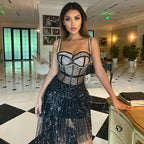 Black halter sequin dress with corset-style bodice and layered tulle skirt
