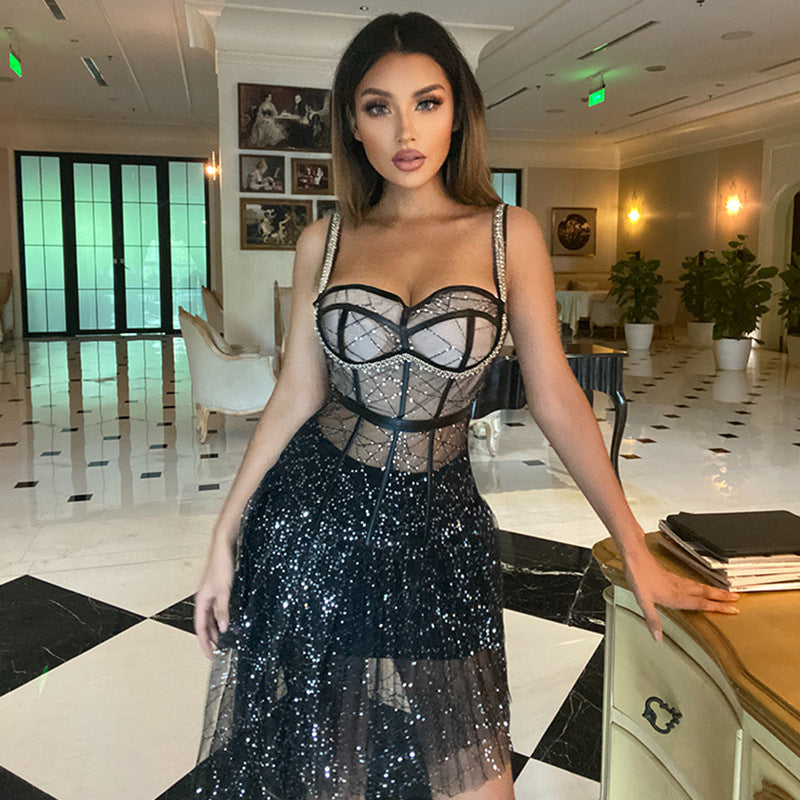 Black halter sequin dress with corset-style bodice and layered tulle skirt