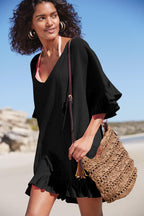 Black slub cotton one-piece swimwear with V-neck, drawstring, and ruffled hem