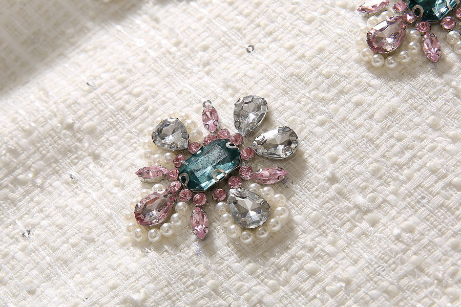 Jeweled sequin flower embellishment in teal, pink, and silver tones