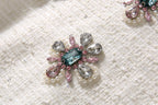 Jeweled sequin flower embellishment in teal, pink, and silver tones