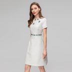 Sequin women's dress with short sleeves, beige and teal/pink jeweled trim