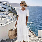 White boho short-sleeve dress with round neck, loose midi hem and layered bottom