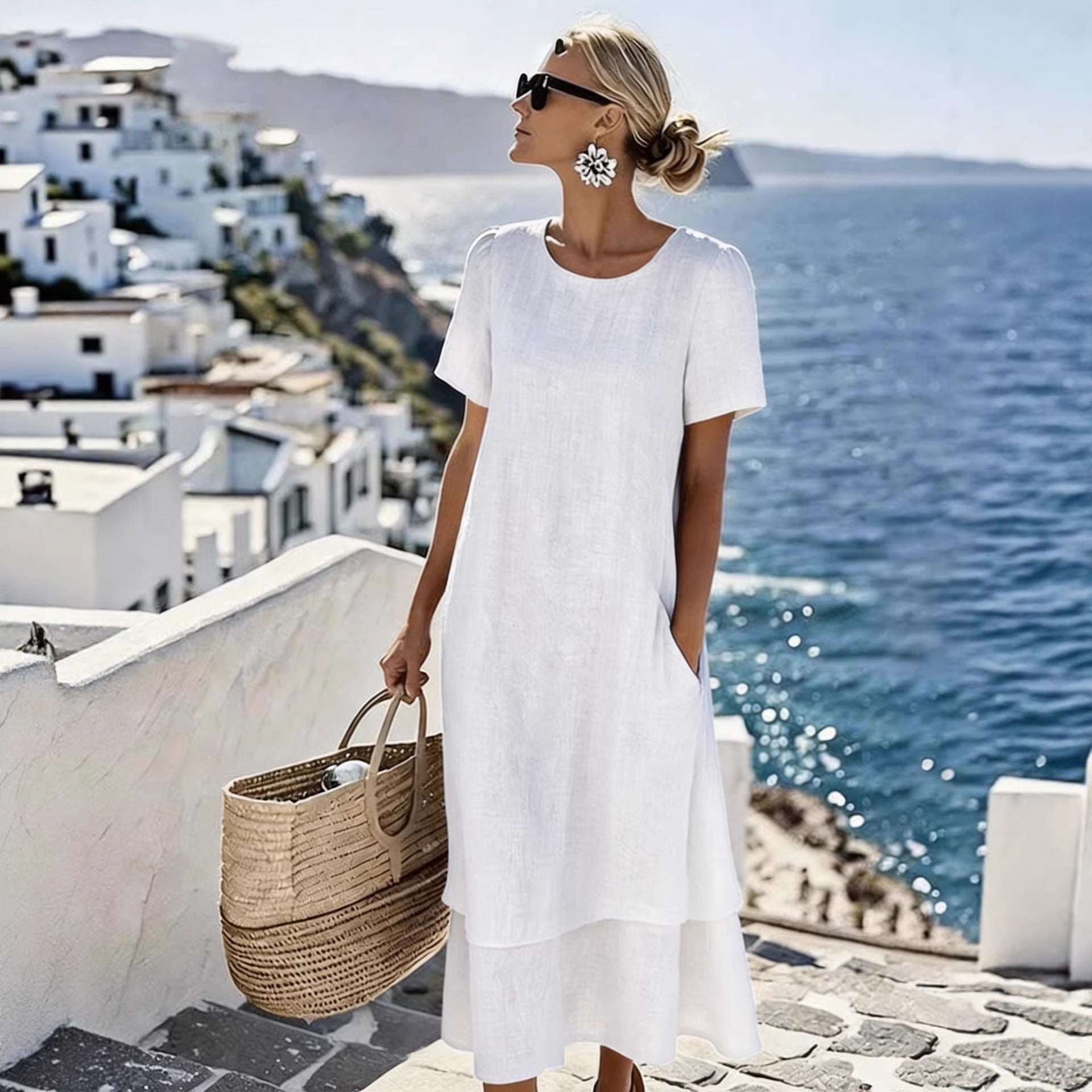 White boho short-sleeve dress with round neck, loose midi hem and layered bottom